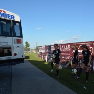 Girls Soccer Team with Premier Transportation Bus Charter